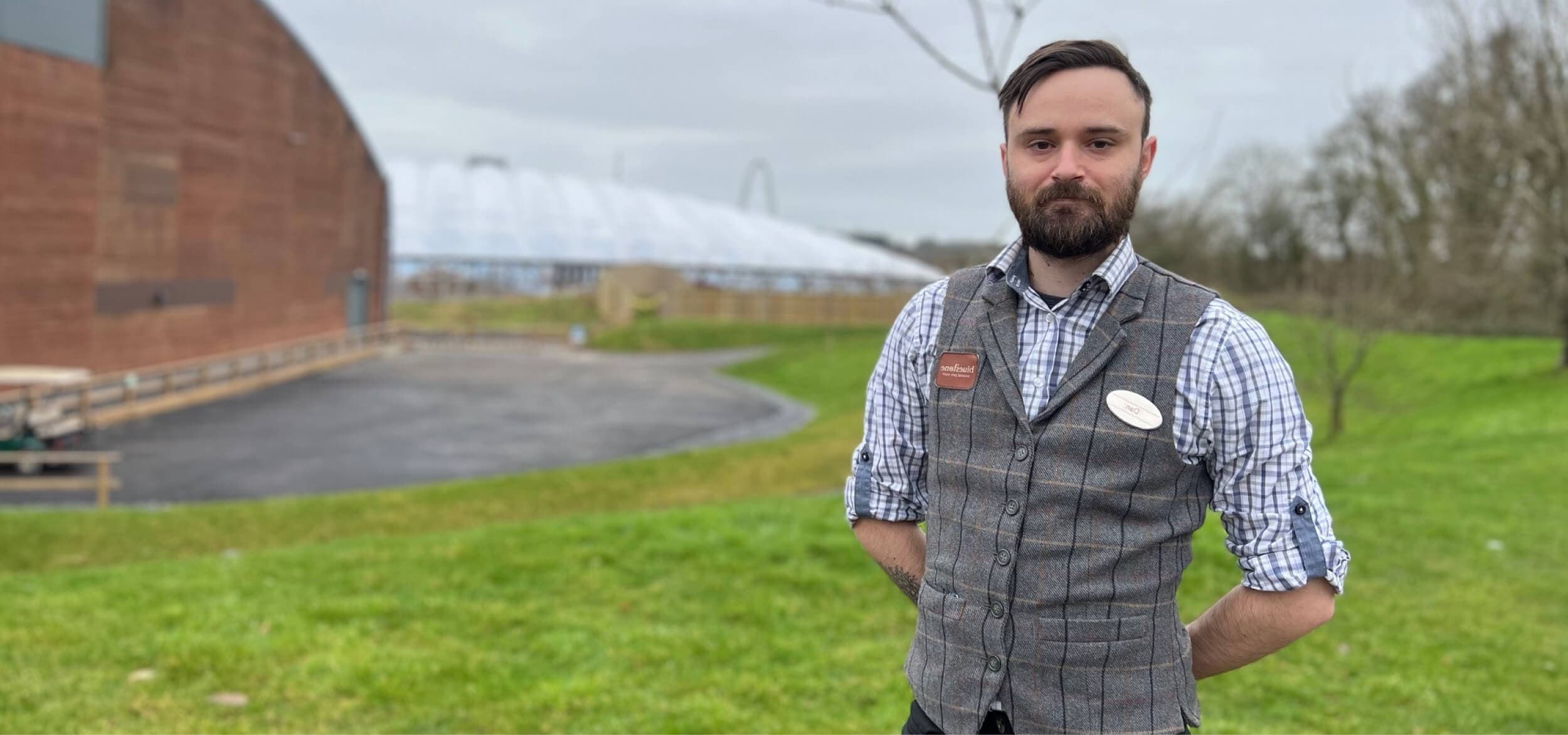 Man posing with the field in the background