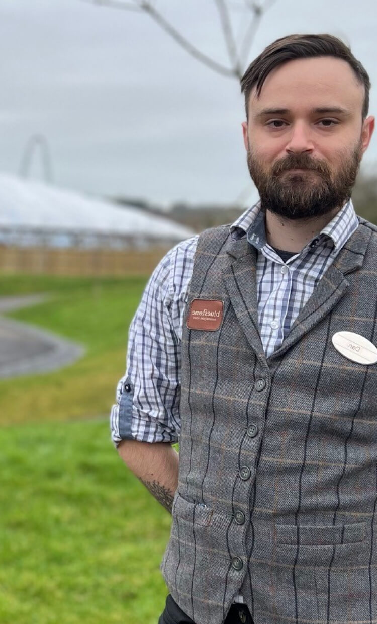 Man posing with the field in the background