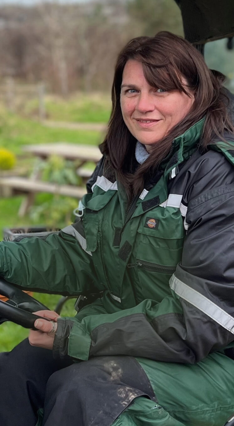 Woman in a golf cart smiling