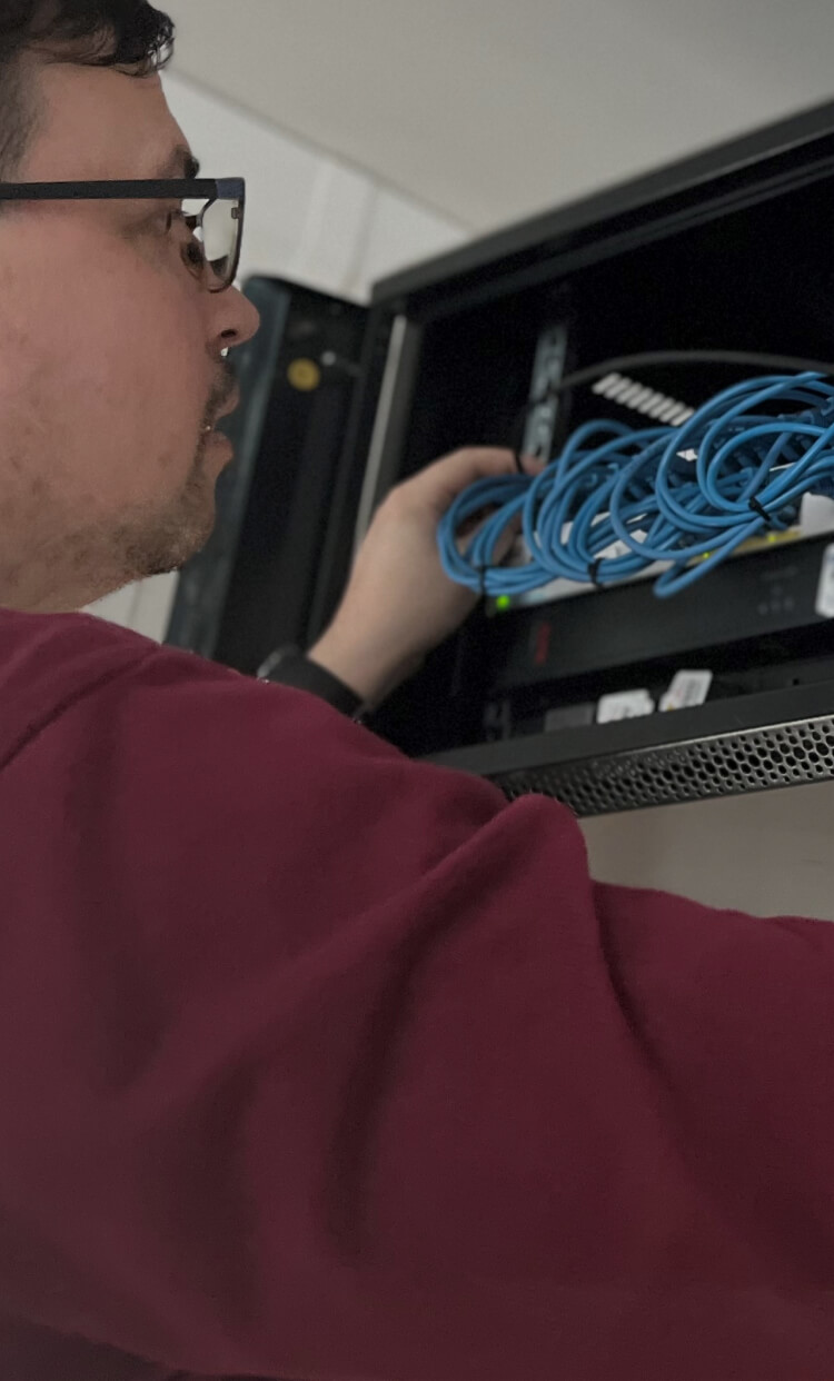 Network engineer looking at a router