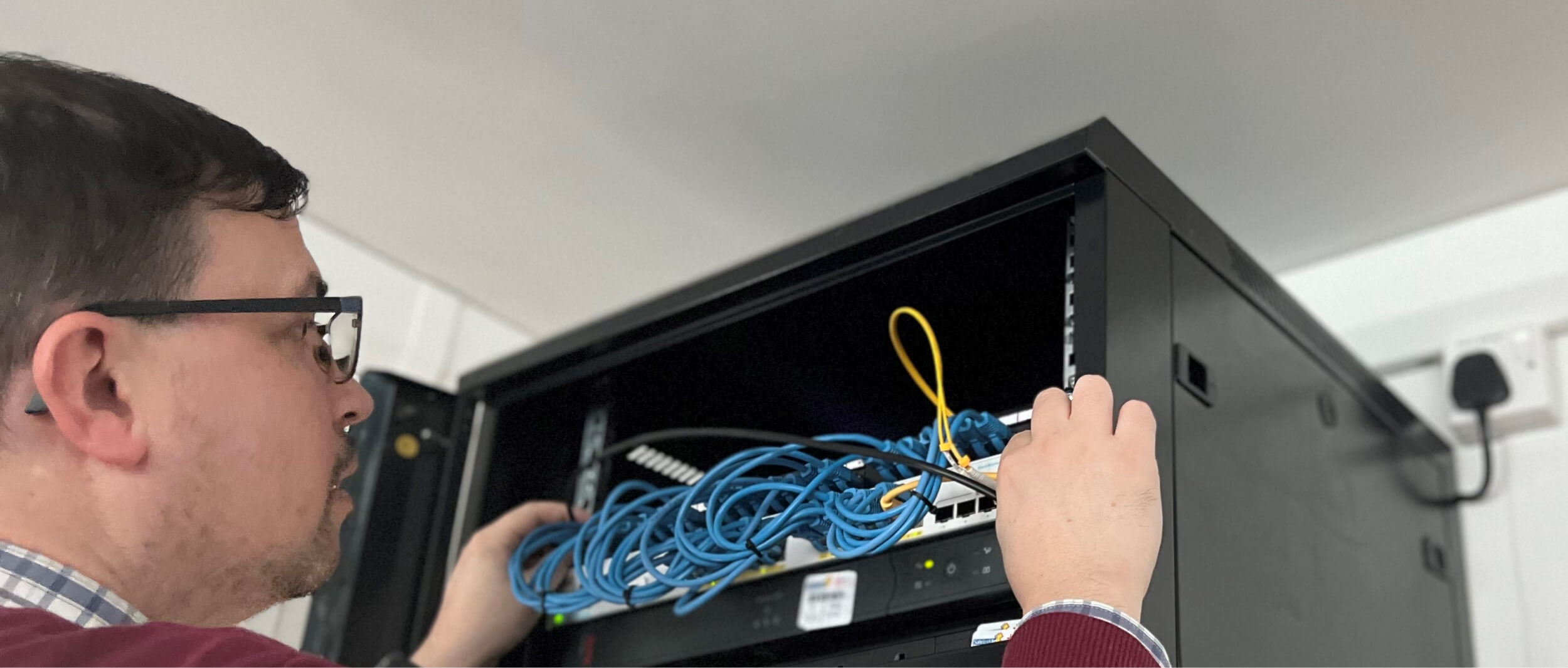 Network engineer looking at a router