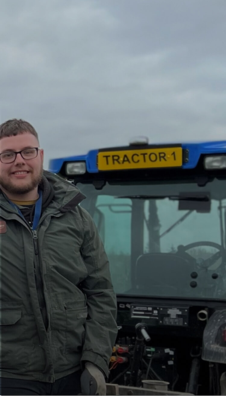 Man in the field smiling