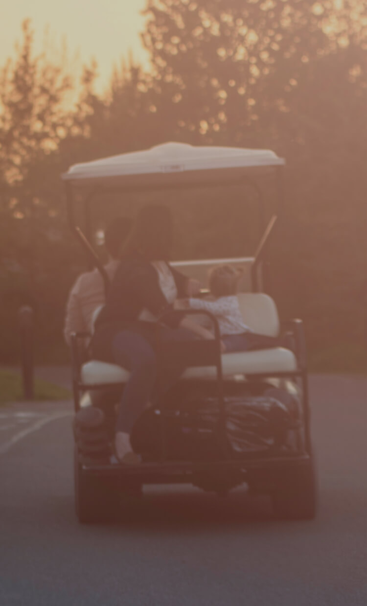 Family in a golf cart