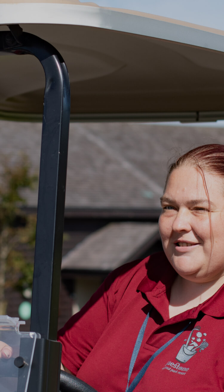 Woman in a golf cart
