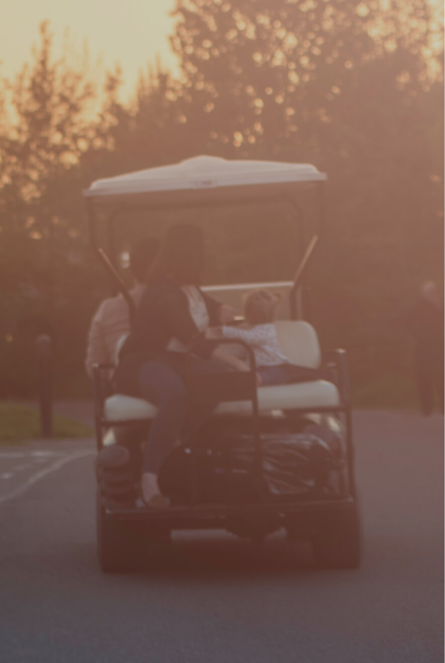 Family in a golf cart