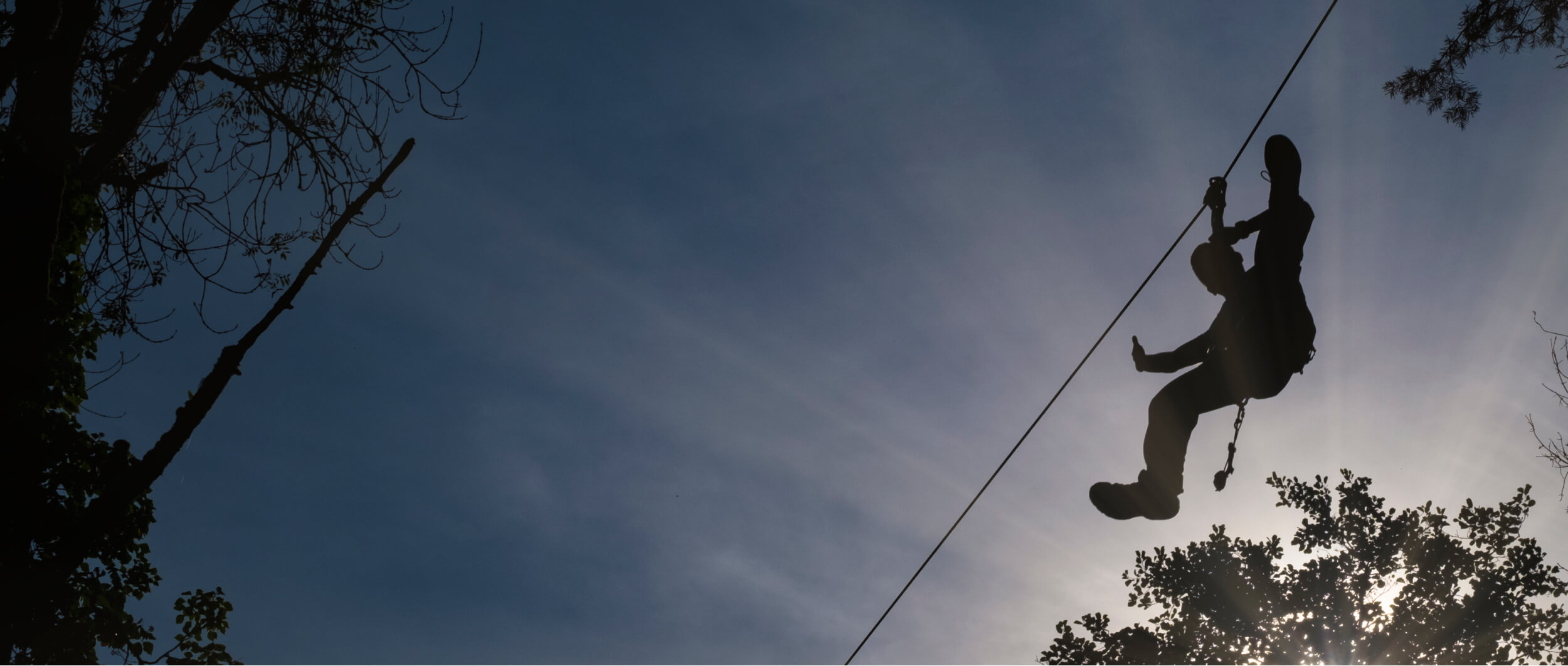 man practicing zipline