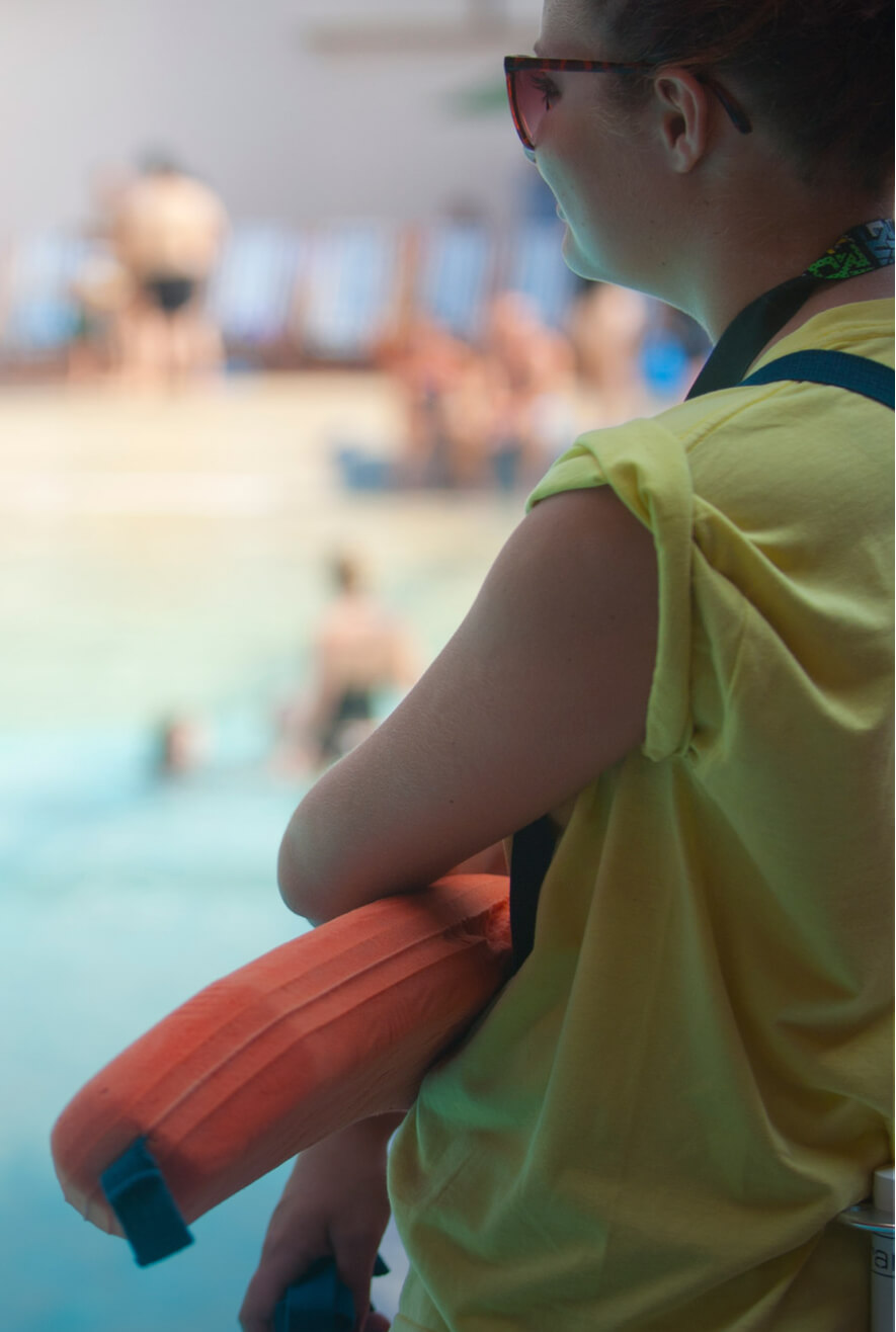 Lifeguard looking to the pool