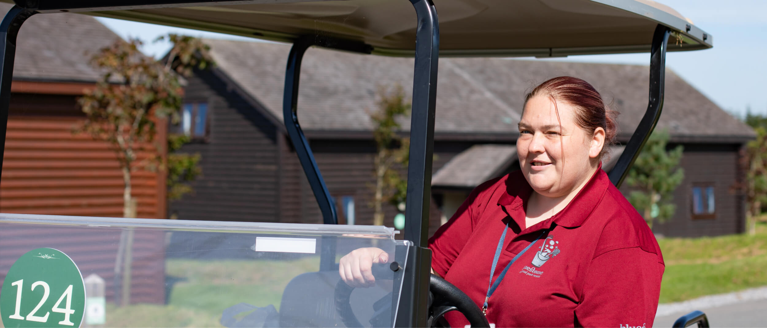 Woman in a golf cart