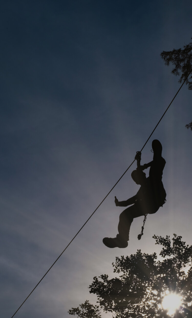 man practicing zipline