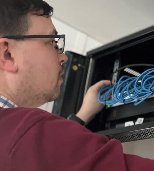 Network engineer looking at a router 