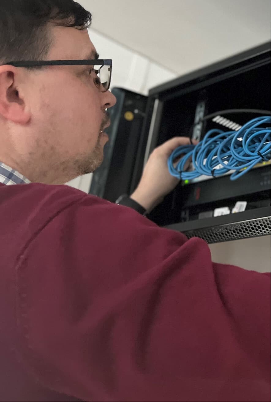 Network engineer looking at a router