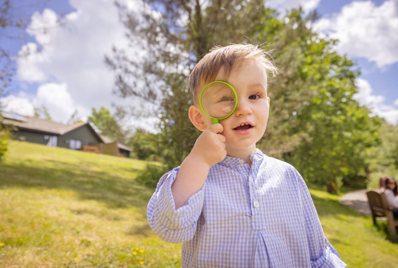 Toddler At Bluestone With Magnifying Glass