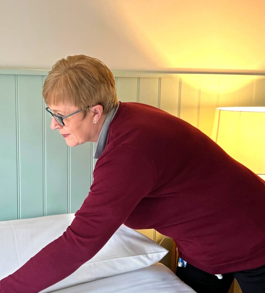 Woman accommodating the bed 